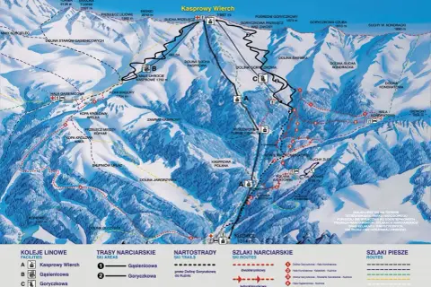 Mapa Tatr z zaznaczonymi szlakami narciarskimi i pieszymi, kolejkami linowymi i szczytami.